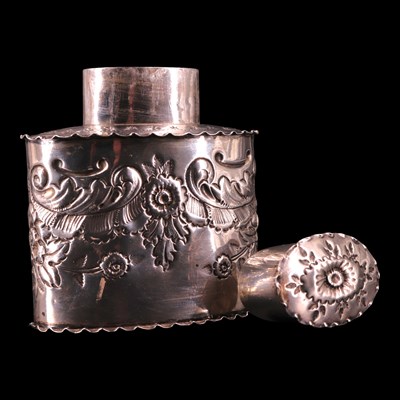 Lot 1183 - A Victorian relief-decorated silver tea caddy,...