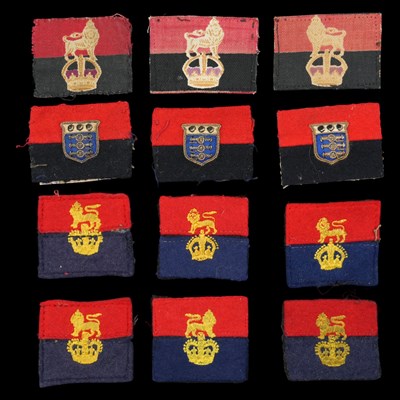 Lot 213 - A group of War Office Units formation signs