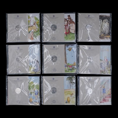 Lot 601 - Nine Royal Mint BUNC Winnie the Pooh 50p coin...