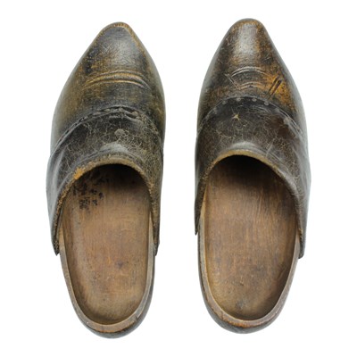Lot 940 - A pair of vintage wooden clogs, having...
