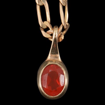 Lot 1280 - A near-contemporary red gemstone-set pendant...