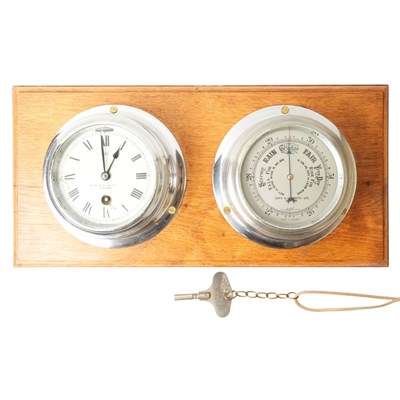 Lot 1497 - A Sestrel marine bulkhead clock and aneroid...