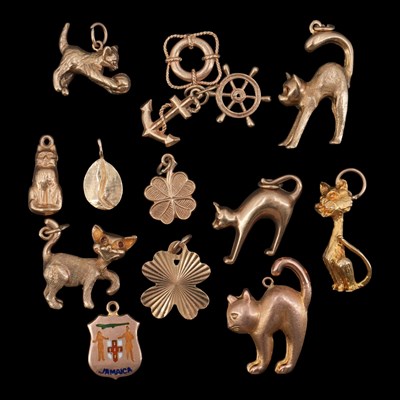 Lot 1289 - Seven vintage 9 ct gold cat / kitten charms...