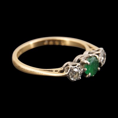 Lot 1301 - A mid 1970s emerald and diamond three-stone...