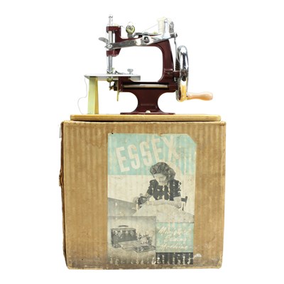 Lot 926 - A vintage Essex miniature sewing machine, in...