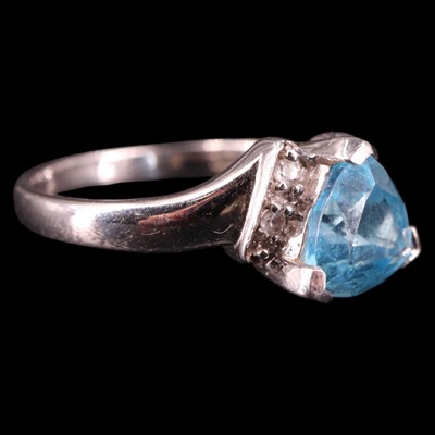 Lot 1308 - A contemporary blue and white topaz ring,...