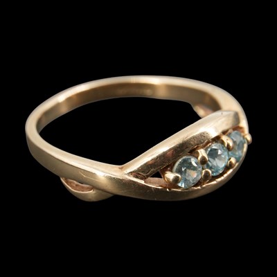 Lot 1315 - A contemporary three-stone pale-blue zircon...