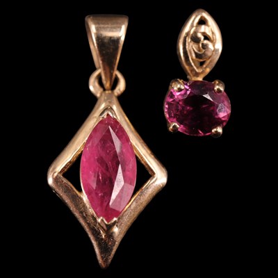 Lot 1330 - Contemporary ruby and rubellite pendants, one...