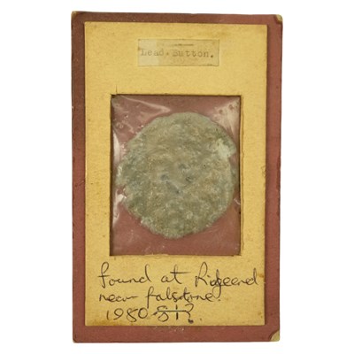 Lot 1004 - A medieval lead button, found at Ridge End,...