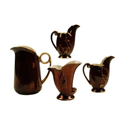 Lot 1027 - Four Carlton Ware "Rouge Royale" jugs, tallest...