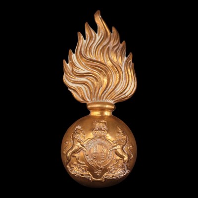 Lot 108 - A Royal Scots Fusiliers fur cap grenade badge,...