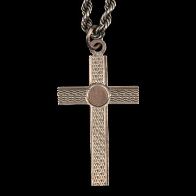 Lot 1344 - A late 1950s 9 ct gold cross pendant suspended...
