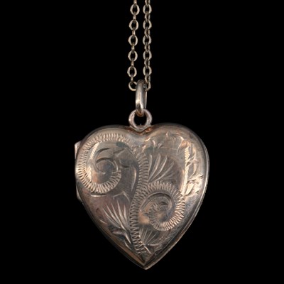Lot 1345 - A mid 1970s 9 ct gold heart-shaped pendant...