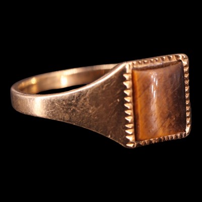 Lot 1358 - An early 1980s tiger's eye signet ring, having...