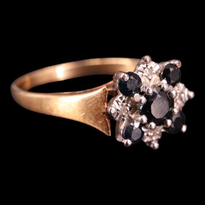 Lot 1359 - A 1980 sapphire and diamond cluster...