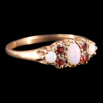 Lot 1361 - An early 1980s opal and garnet...