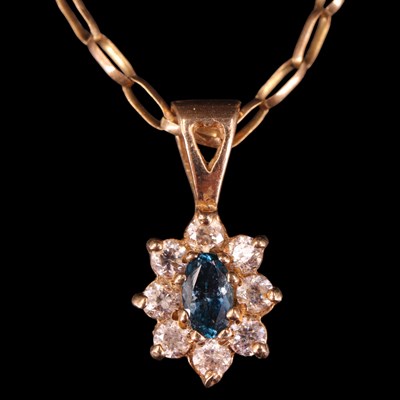 Lot 1371 - A vintage sapphire and white gemstone cluster...