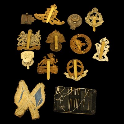 Lot 174 - A small group of cap and other badges,...
