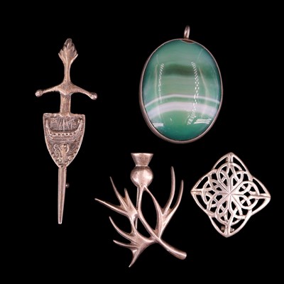 Lot 1382 - A 1970s Scottish silver stylised thistle...
