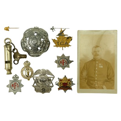 Lot 780 - A group of Police and Fire Brigade cap badges etc