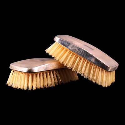 Lot 1194 - A pair of George VI silver-backed brushes,...