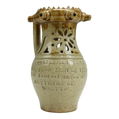 Lot 1065 - A 19th Century stoneware puzzle jug, having a...