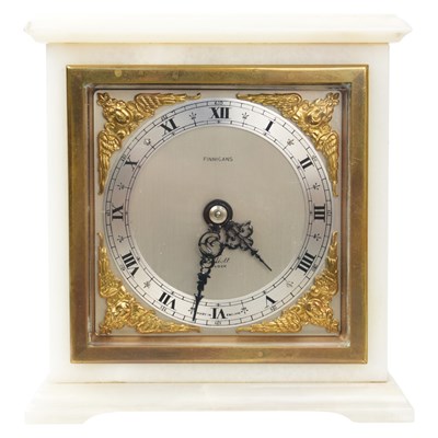 Lot 1075 - An Elliot white onyx mantle clock retailed by...