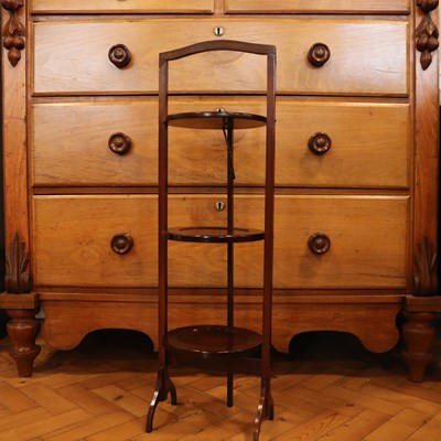 Lot 1604 - A George V mahoghany folding cake stand, circa...