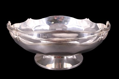 Lot 891 - A 1920s silver large swing-handled footed bowl,...