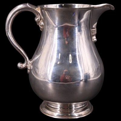 Lot 747 - A large Georgian-style silver baluster water...