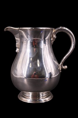 Lot 747 - A large Georgian-style silver baluster water...