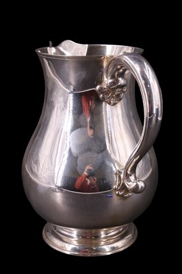 Lot 747 - A large Georgian-style silver baluster water...