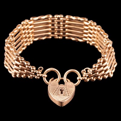 Lot 1419 - A 9 ct gold gate-link bracelet, 16 mm, 17.5 cm,...