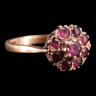 Lot 1425 - A 1970s almandine and 9 ct gold cluster...