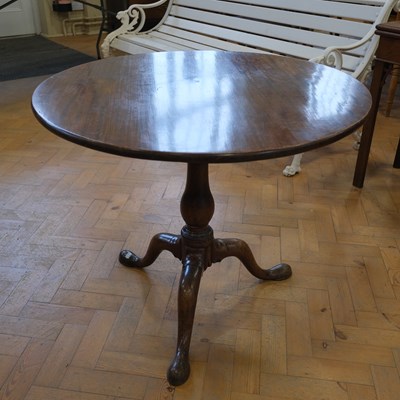 Lot 1628 - A George III mahogany tripod tea table, having...