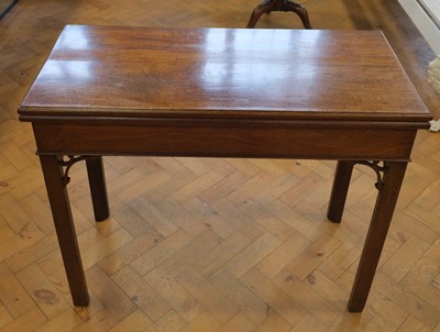 Lot 1631 - A George III mahogany turn-over-top games...