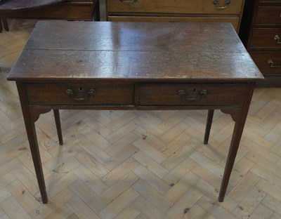 Lot 1634 - A George III oak writing or side table, 92 cm...