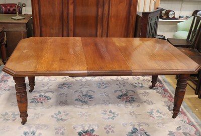 Lot 1640 - A Victorian oak wind-out dining table, 158 cm...