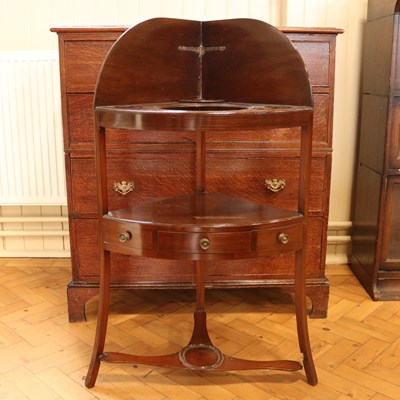 Lot 1664 - A George III mahogany corner wash stand, 105...