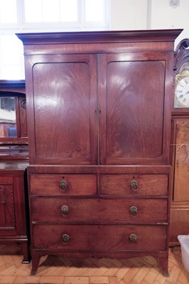 Lot 1667 - An early 19th Century mahogany clothes...