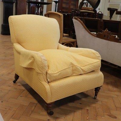 Lot 1674 - A late Victorian upholstered lounge armchair...