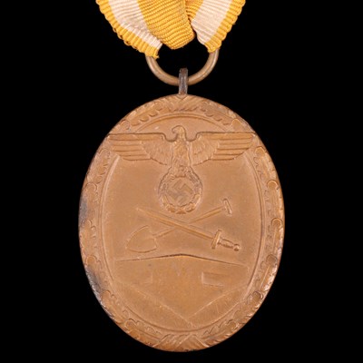 Lot 85 - A German Third Reich West Wall medal, together...