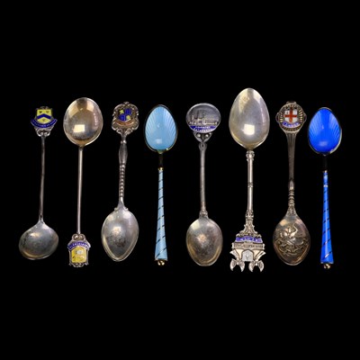 Lot 888 - A quantity of silver and enamel souvenir...