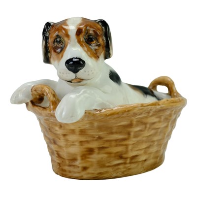 Lot 829 - A Royal Doulton figurine of a terrier puppy in...