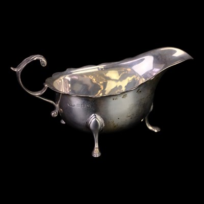 Lot 890 - A George V small silver sauce boat, of...