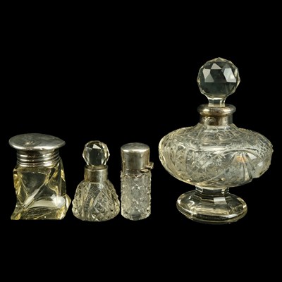 Lot 687 - Four silver-mounted glass dressing table...