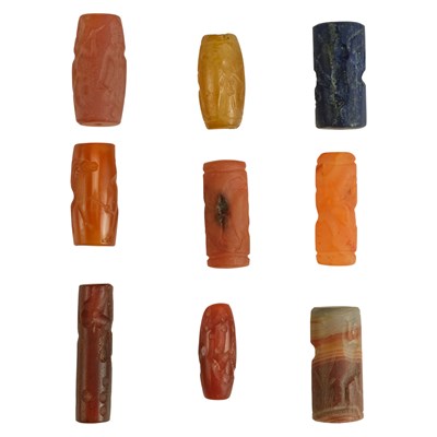 Lot 724 - A collection of Assyrian-style agate, lapis...