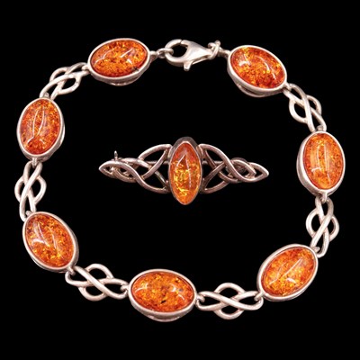 Lot 1002 - A near contemporary sun-spangled amber and...