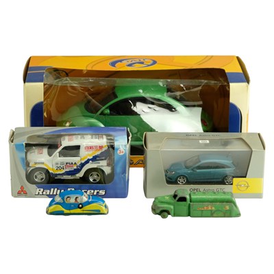 Lot 649 - A small group of diecast toy cars, including...