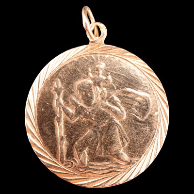 Lot 989 - A 9 ct gold St Christopher pendant,  Henry...